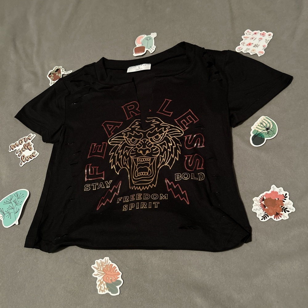 cute cropped tee with tear designs all over it
